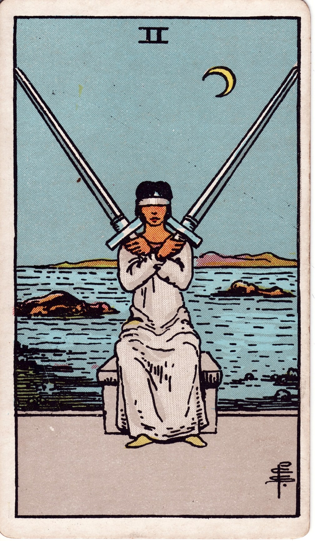 Two of Swords Tarot Card Meaning: How to Overcome Indecision & Move Forward