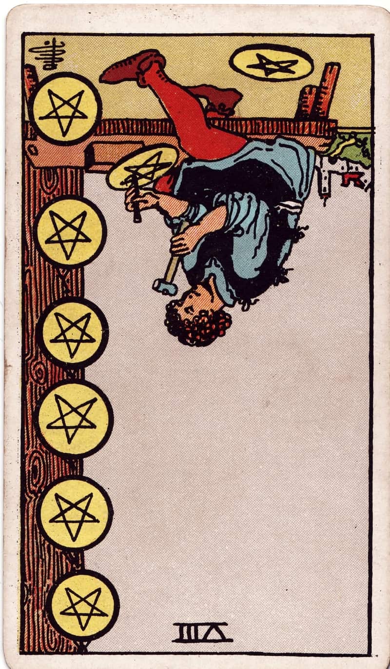 Eight of Pentacles reversed tarot card