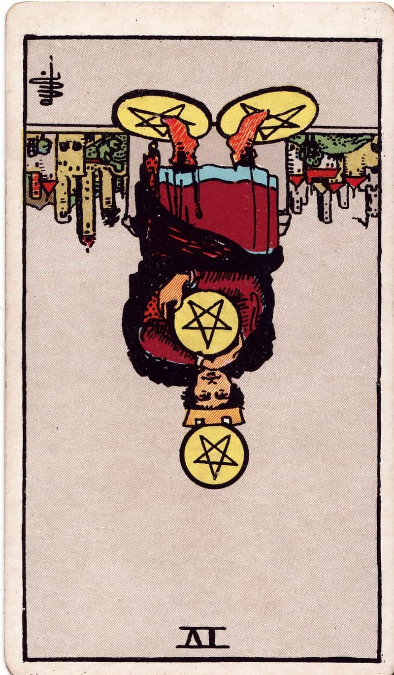 Four of Pentacles reversed tarot card