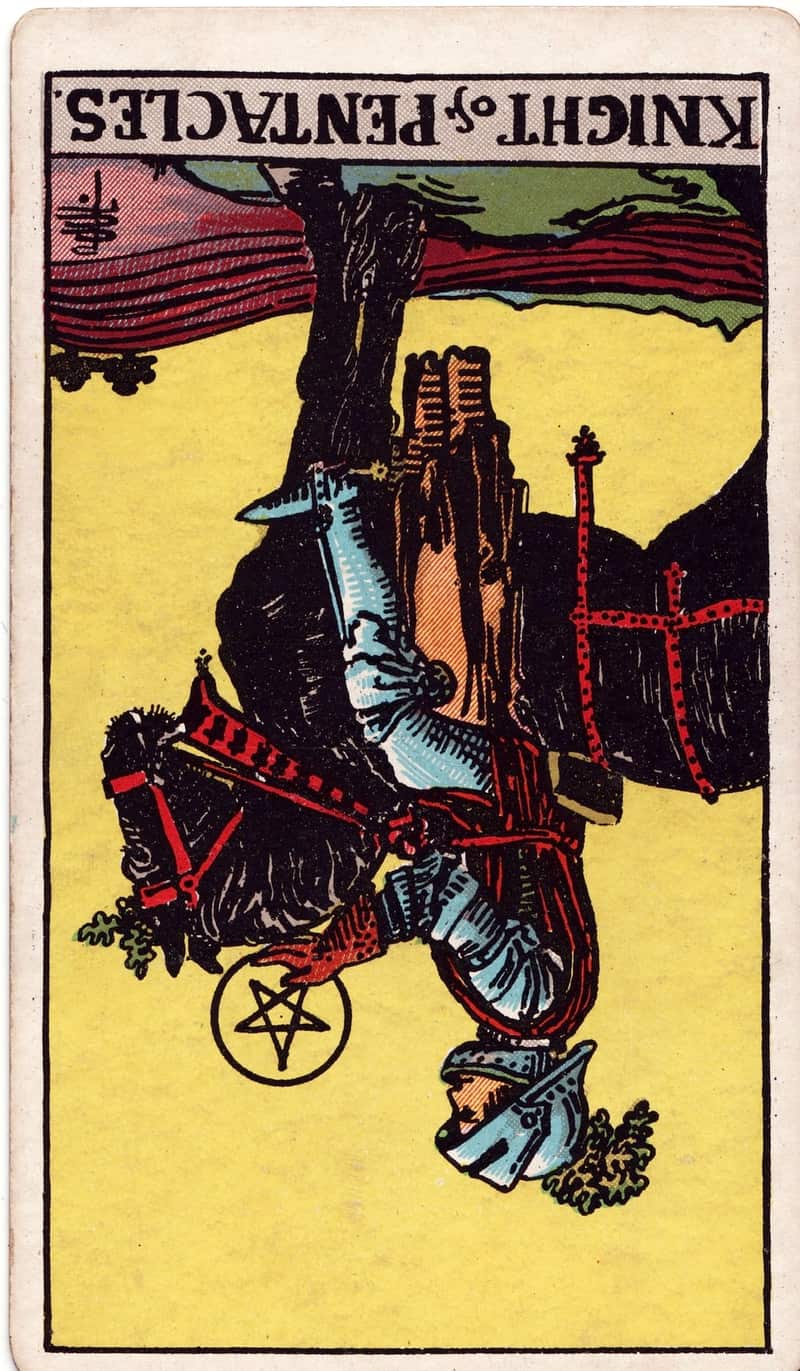 Knight of Pentacles reversed tarot card