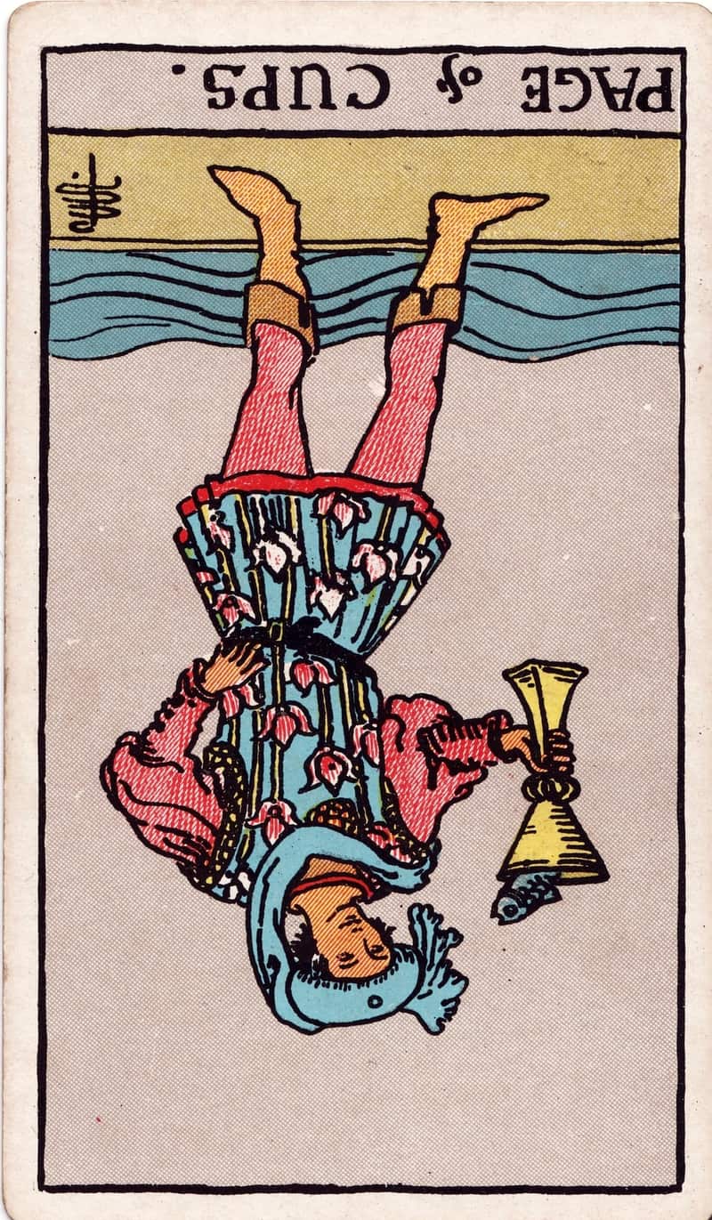 Page of Cups reversed tarot card