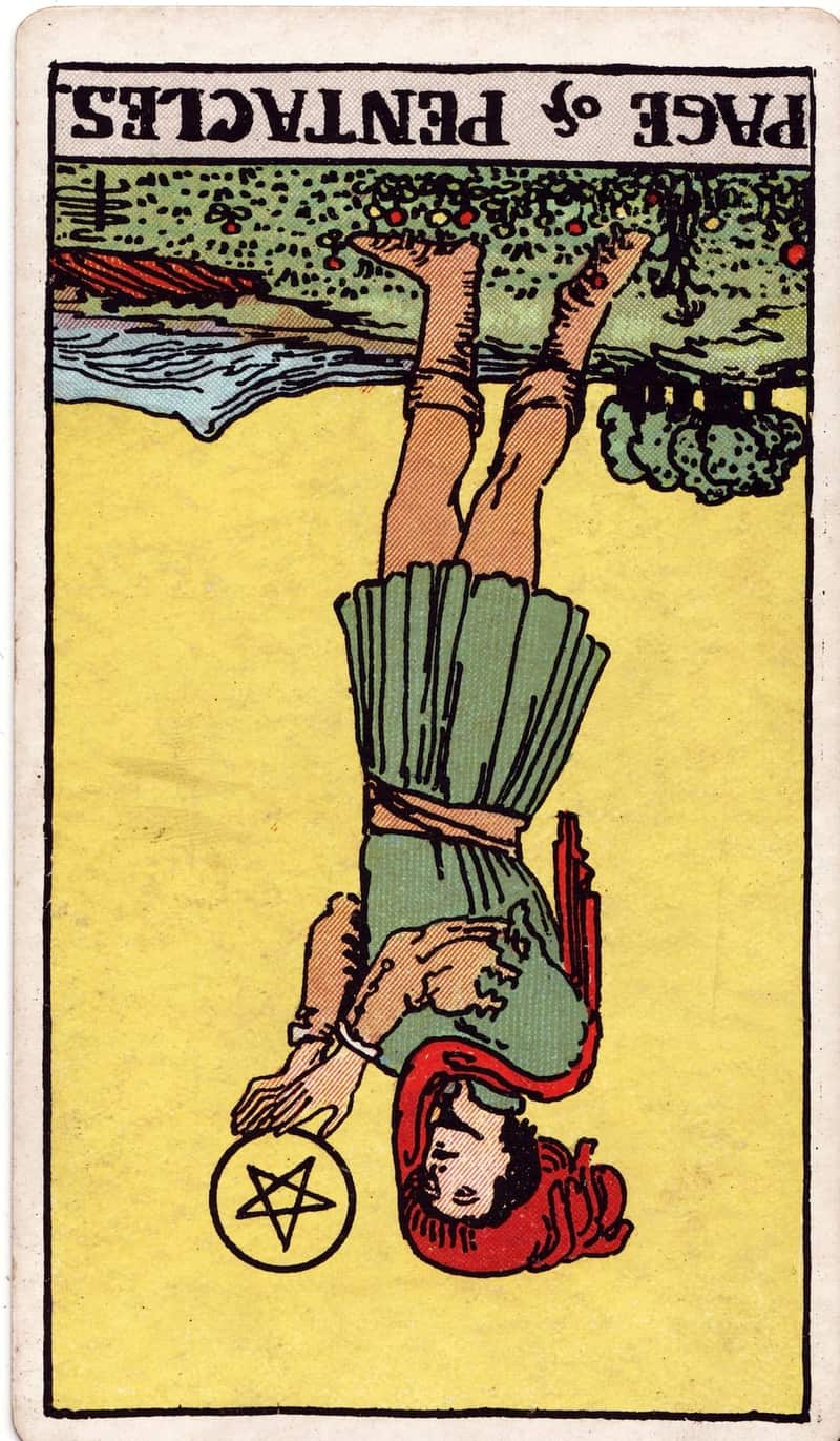 Page of Pentacles reversed tarot card