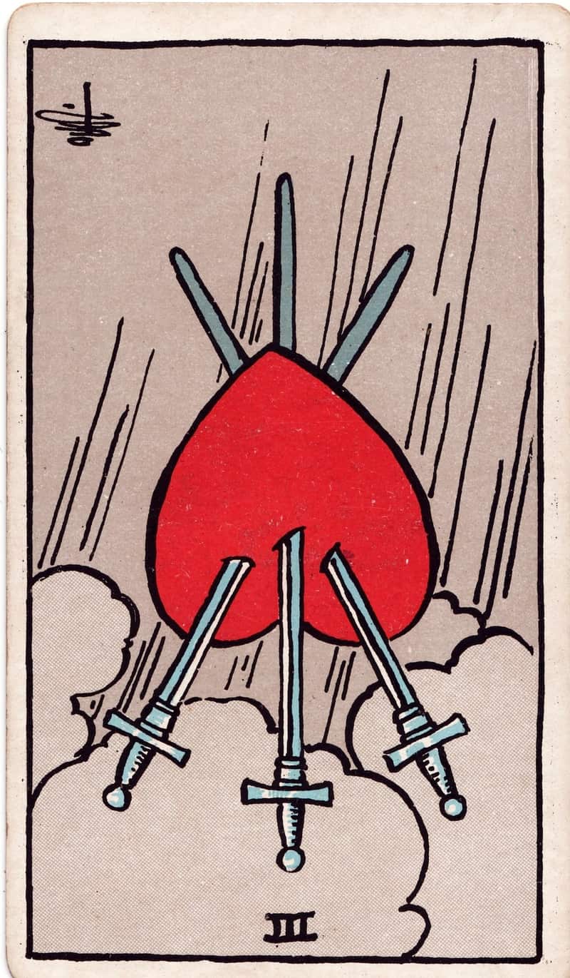 Three of Swords reversed tarot card