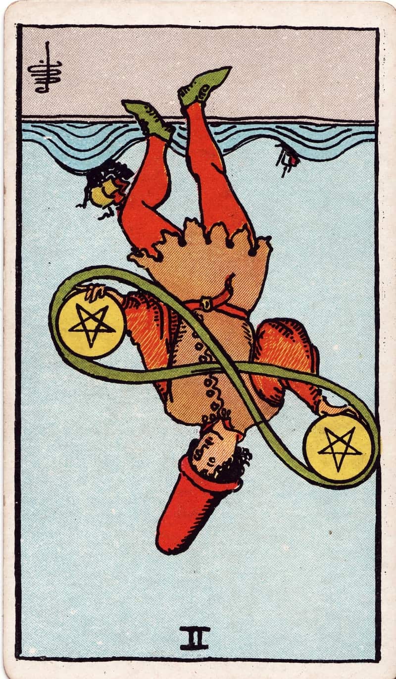 Two of Pentacles reversed tarot card